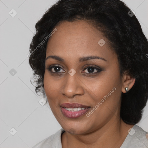 Joyful black young-adult female with medium  black hair and brown eyes