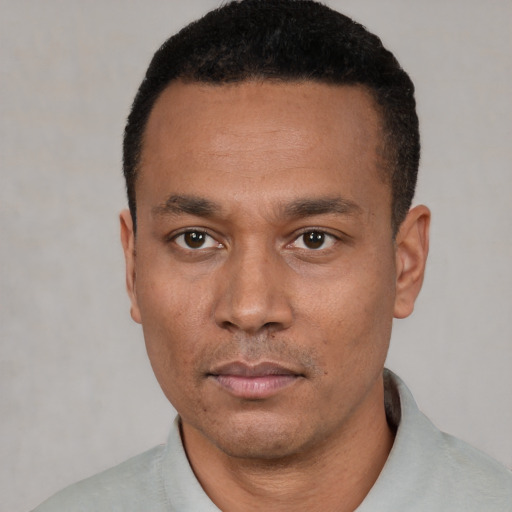 Neutral black young-adult male with short  black hair and brown eyes