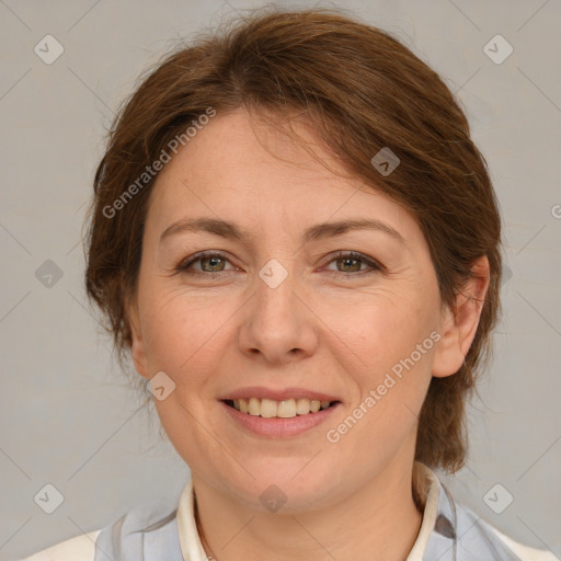 Joyful white adult female with medium  brown hair and grey eyes