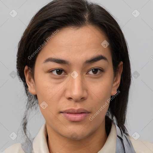 Joyful latino young-adult female with medium  brown hair and brown eyes