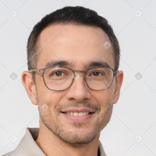 Joyful white adult male with short  black hair and brown eyes