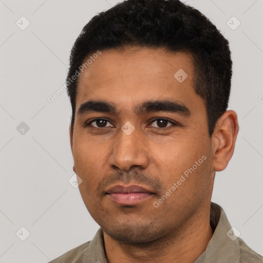 Neutral latino young-adult male with short  black hair and brown eyes