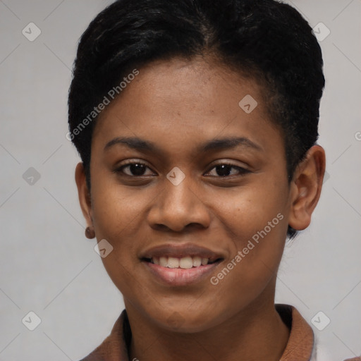 Joyful black young-adult female with short  black hair and brown eyes