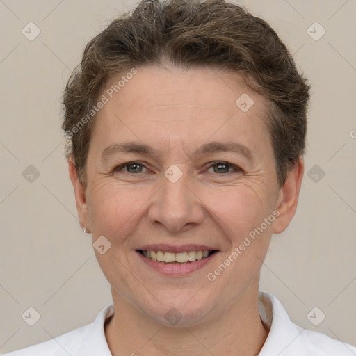 Joyful white adult female with short  brown hair and brown eyes