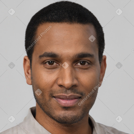 Joyful black young-adult male with short  black hair and brown eyes