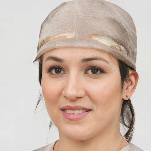 Joyful white young-adult female with medium  brown hair and brown eyes