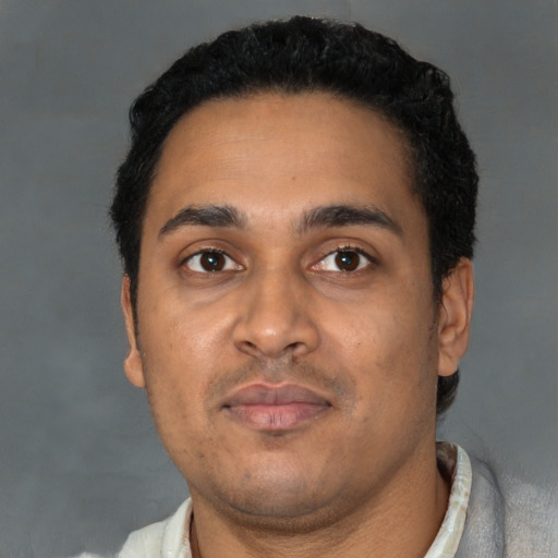 Neutral latino young-adult male with short  black hair and brown eyes
