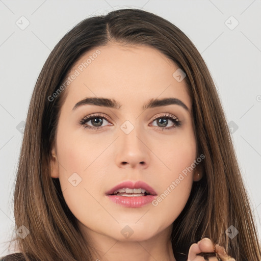 Neutral white young-adult female with long  brown hair and brown eyes