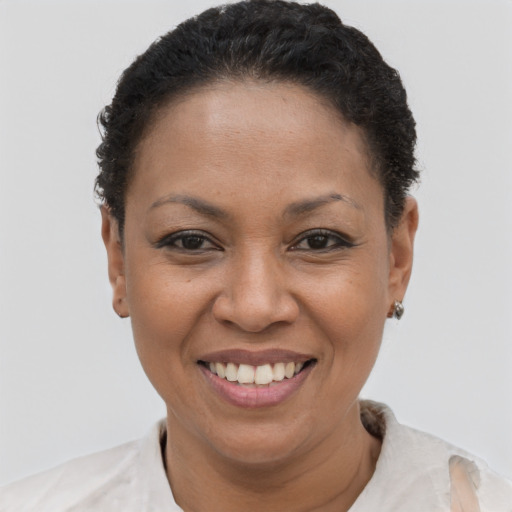 Joyful latino young-adult female with short  brown hair and brown eyes