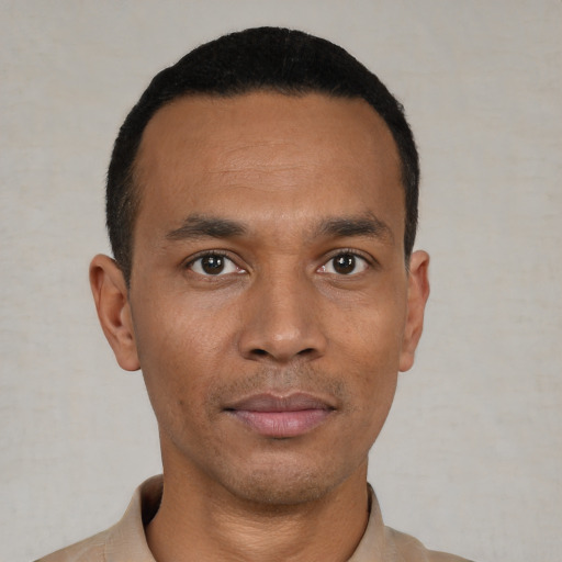 Neutral black young-adult male with short  black hair and brown eyes