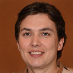 Joyful white young-adult male with medium  brown hair and brown eyes