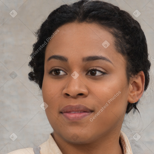 Joyful black young-adult female with medium  black hair and brown eyes