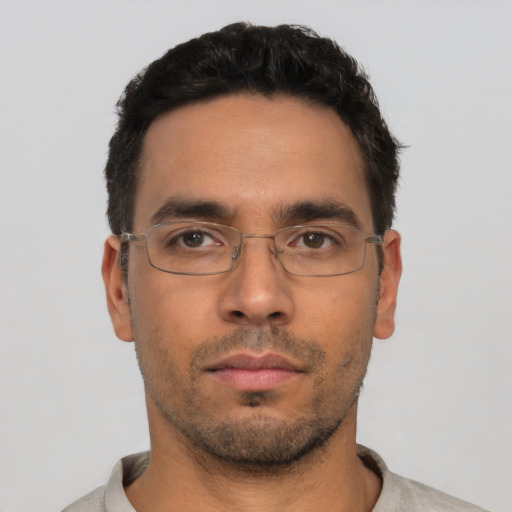 Neutral white young-adult male with short  black hair and brown eyes