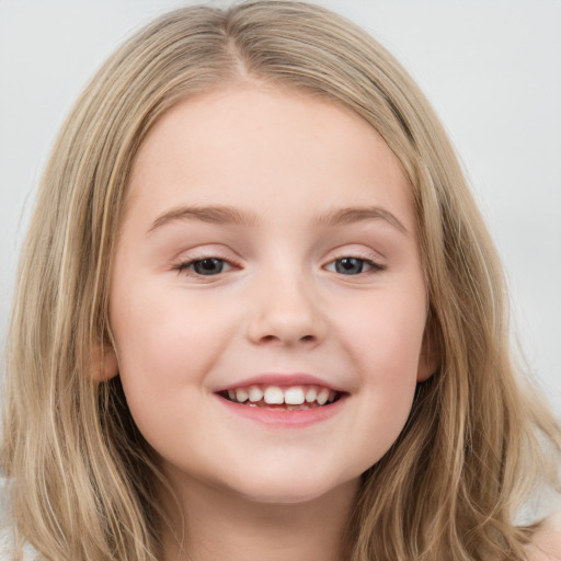 Joyful white child female with long  brown hair and brown eyes