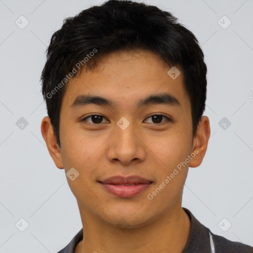 Joyful asian young-adult male with short  brown hair and brown eyes