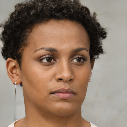 Neutral black young-adult female with short  brown hair and brown eyes