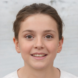 Joyful white child female with short  brown hair and brown eyes