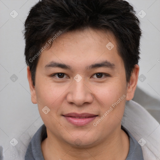 Joyful asian young-adult male with short  brown hair and brown eyes