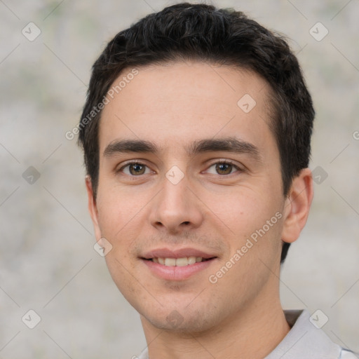 Joyful white young-adult male with short  black hair and brown eyes