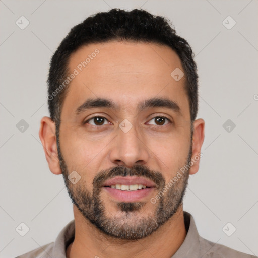 Joyful latino young-adult male with short  black hair and brown eyes