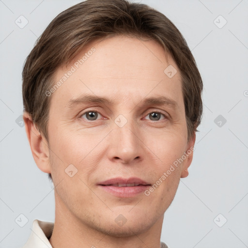 Joyful white adult male with short  brown hair and grey eyes