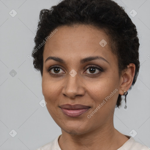 Joyful latino adult female with short  brown hair and brown eyes