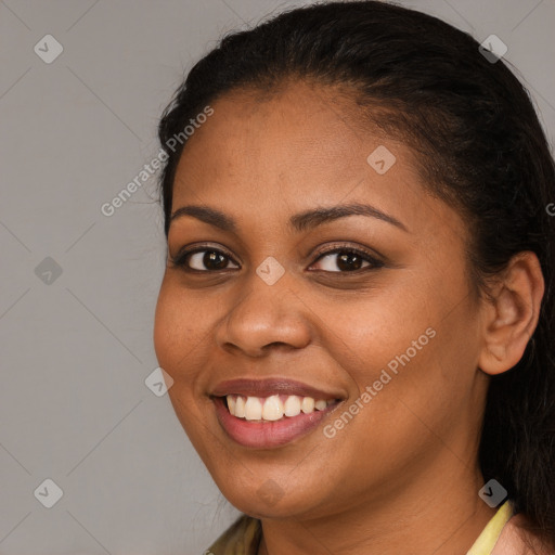 Joyful latino young-adult female with long  brown hair and brown eyes