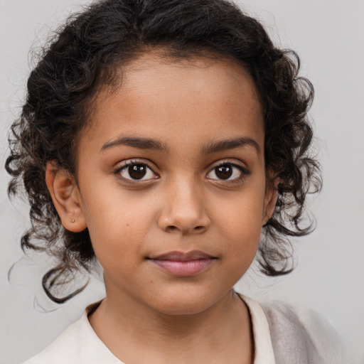 Neutral latino child female with medium  brown hair and brown eyes