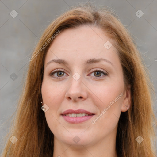 Joyful white adult female with long  brown hair and grey eyes