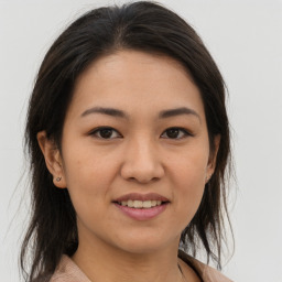 Joyful asian young-adult female with medium  brown hair and brown eyes