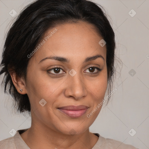 Joyful latino adult female with medium  brown hair and brown eyes