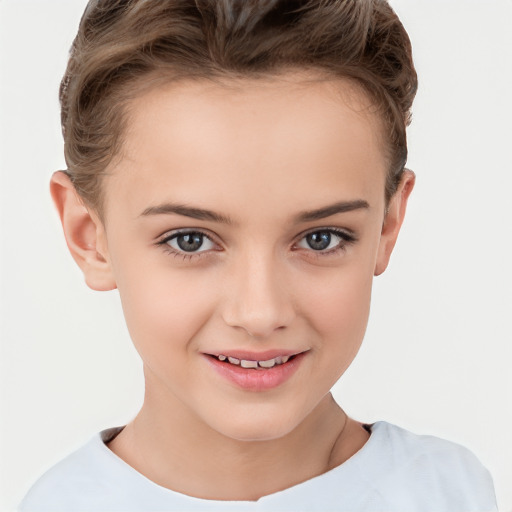 Joyful white child female with short  brown hair and brown eyes