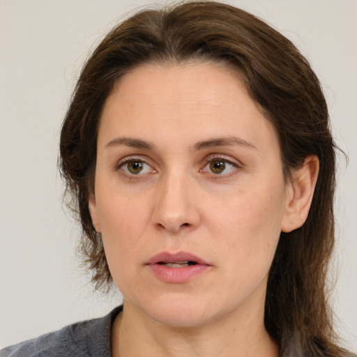 Neutral white adult female with medium  brown hair and brown eyes