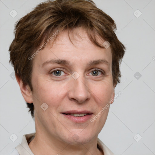 Joyful white adult female with short  brown hair and grey eyes