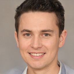Joyful white adult male with short  brown hair and brown eyes