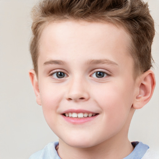 Joyful white child male with short  brown hair and grey eyes