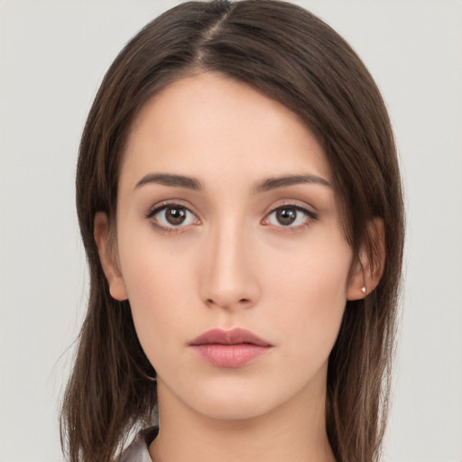 Neutral white young-adult female with long  brown hair and brown eyes