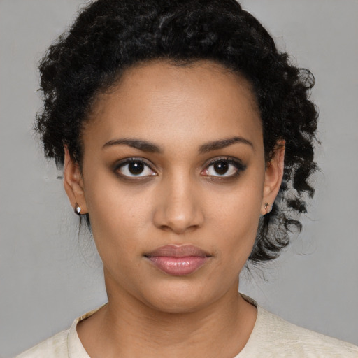 Neutral black young-adult female with short  black hair and brown eyes
