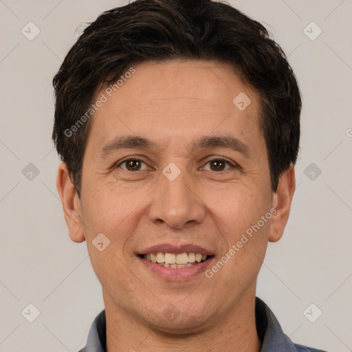 Joyful white adult male with short  brown hair and brown eyes