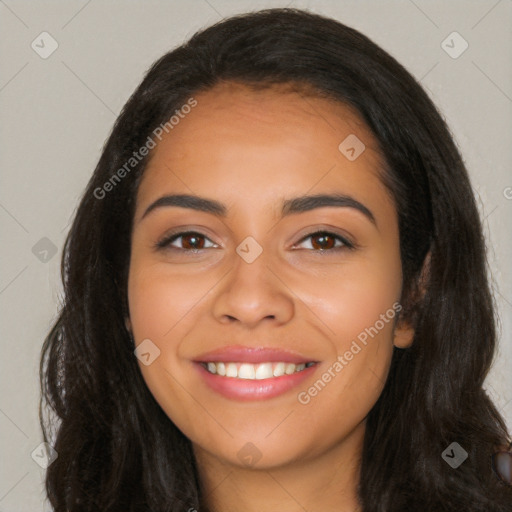 Joyful latino young-adult female with long  black hair and brown eyes