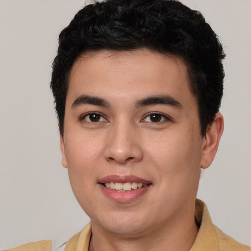 Joyful asian young-adult male with short  brown hair and brown eyes