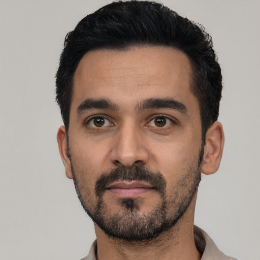 Neutral latino young-adult male with short  black hair and brown eyes