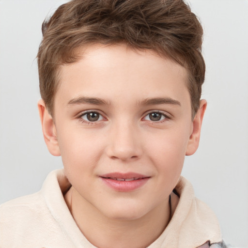 Joyful white child male with short  brown hair and brown eyes