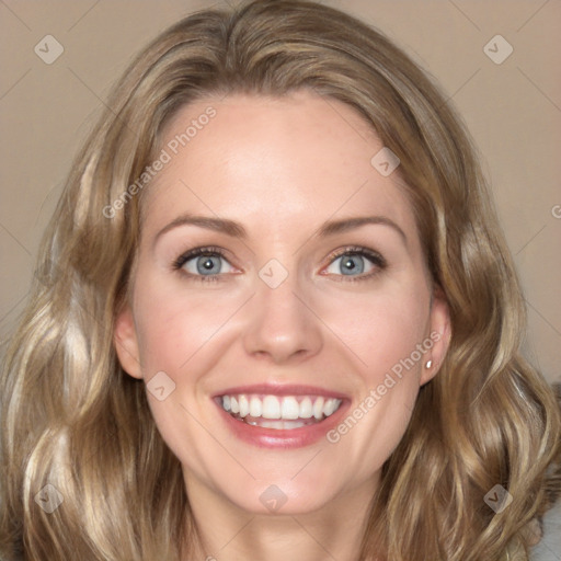 Joyful white young-adult female with medium  brown hair and blue eyes