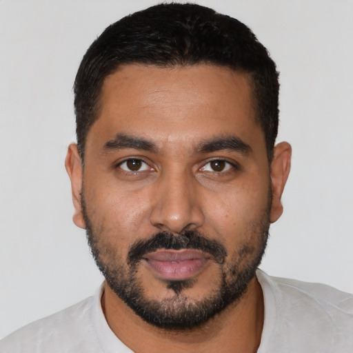 Neutral latino young-adult male with short  black hair and brown eyes