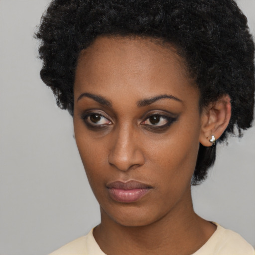 Neutral black young-adult female with short  black hair and brown eyes