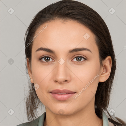 Neutral white young-adult female with long  brown hair and brown eyes