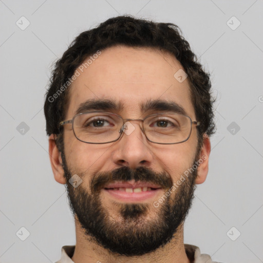 Joyful white adult male with short  black hair and brown eyes