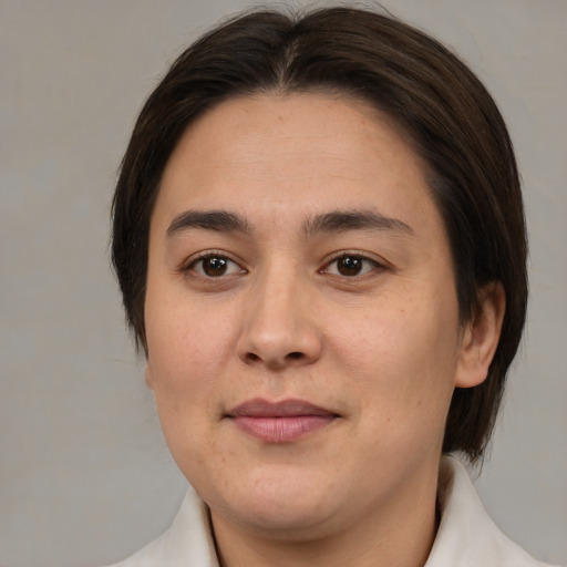 Joyful white young-adult female with medium  brown hair and brown eyes