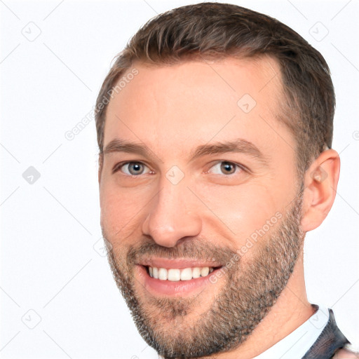 Joyful white adult male with short  brown hair and brown eyes